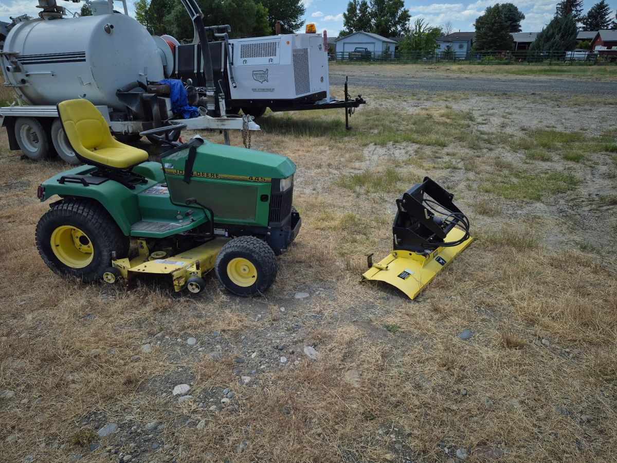 John Deere 445 and snow plow